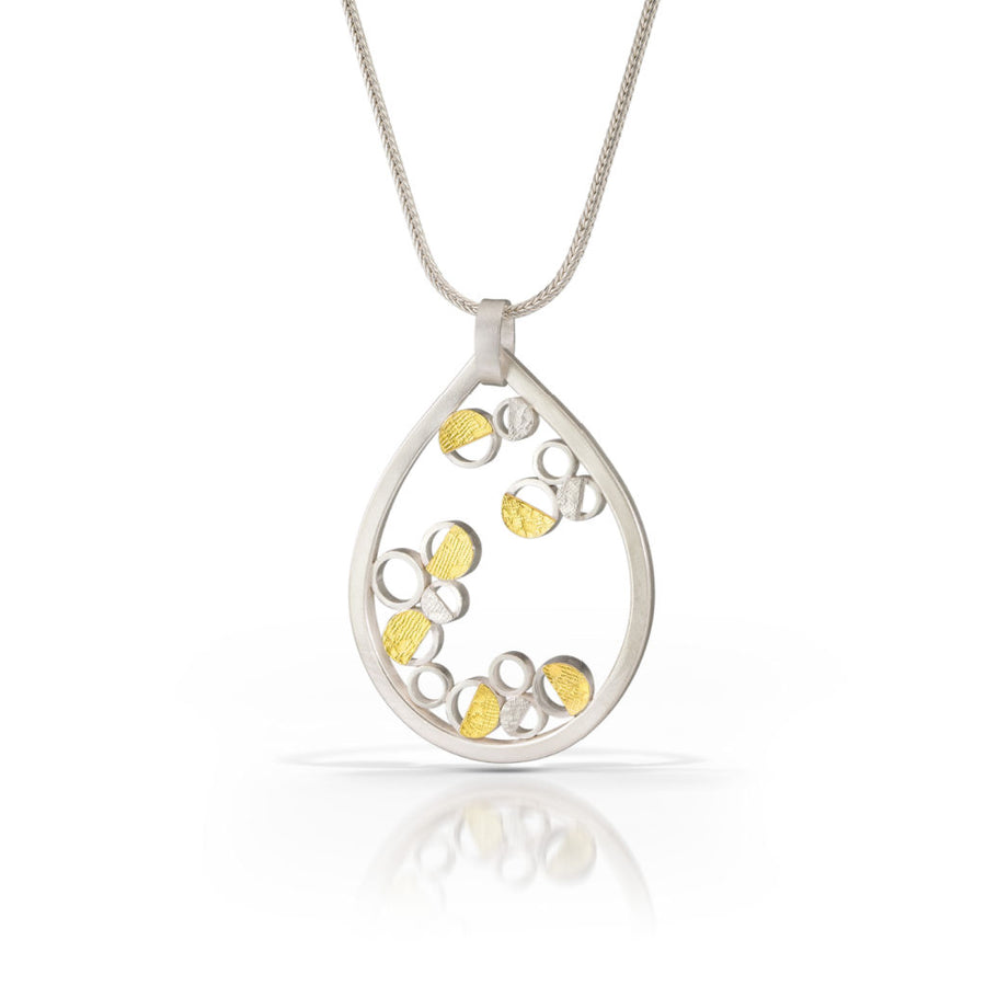 EG Speiser jewelry signature lily pendant made of recycled sterling silver and 22K gold bimetal.  A handcrafted elegant statement sure to be timeless.