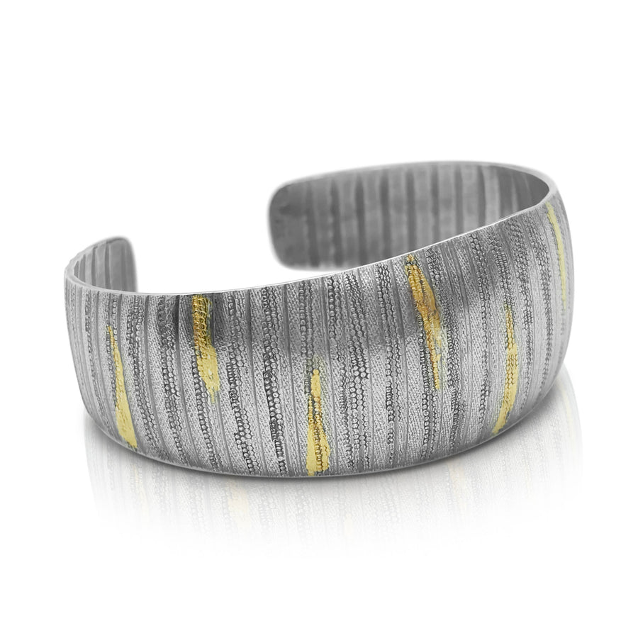 EG Speiser jewelry handcrafted textured statement cuff made of oxidized sterling silver and accented with gold keum boo.  Wearable art.